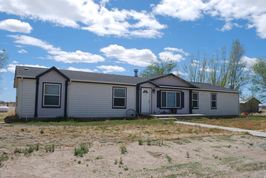Great home with animal rights!  Open floor plan.  Great for gatherings with living room & two family rooms!  Almost all updated within the last 5 years & will be updating some paint (more pictures coming when finished).  Central air less than 1 year old.  Additional land available, if desired for over 10 acres (see mls #2153309).  Blinds included. Draperies are excluded.  Well on property will be sold with .25 acre feet water.  Property zoned residential, commercial or agricultural.  Please try to give 24 hr notice to show to schedule work & dogs.