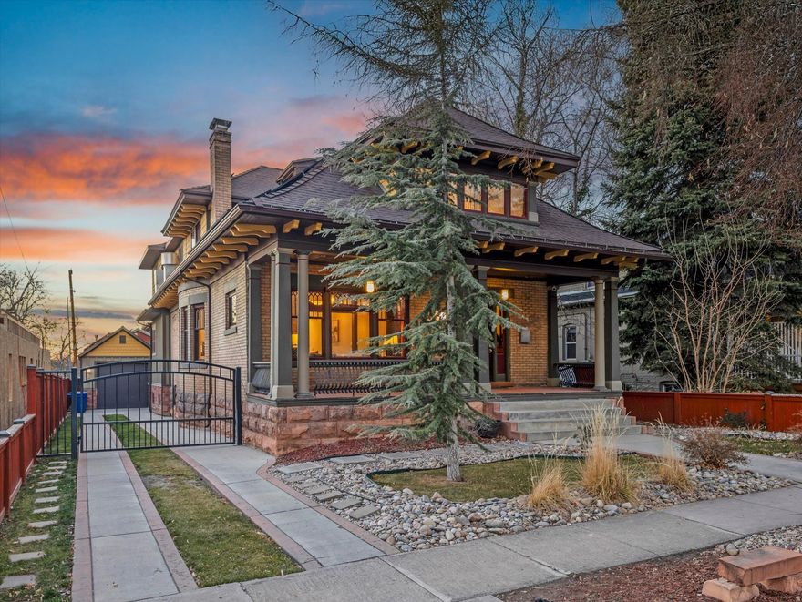 A masterful blend of timeless elegance and modern refinement, this extraordinary home will leave a lasting impression. Exceptional craftsmanship is showcased throughout, from the rich original woodwork and sweeping grand staircase to the striking antique fireplace and expansive windows that flood the home with natural light. The thoughtfully designed layout offers a seamless balance of refined daily living and elegant entertaining. Classic architectural details elevate every space, including beveled glass windows, graceful French doors, bespoke light fixtures, and multiple fireplaces that add warmth and character. The heart of the home is a chef-caliber, restaurateur-designed kitchen, appointed with an industrial-grade range and dual islands that provide unparalleled space for preparation and hosting. The formal dining area pairs beautifully with a charming breakfast nook, creating the perfect setting for intimate gatherings or grand celebrations alike. The meticulously restored upper level features a versatile office or playroom, generously sized bedrooms and bath, and an exquisite primary suite offering a true private retreat. Here, you'll find a spa-inspired bathroom, walk-in closet, private fireplace, and a secluded deck designed for quiet moments of relaxation. The lower level enhances the home's versatility with a newly added second kitchen, a laundry room, spacious bedroom, flexible living space suitable for a secondary bedroom, and a private entrance-ideal for hosting guests or accommodating multi-generational living. Outdoors, the serene backyard provides space to unwind or entertain, complemented by a rare 2.5-car garage and valuable water shares. Perfectly positioned near Liberty Heights, 9th & 9th, 15th & 15th, Emigration Canyon, and Sugar House, this exceptional home places you just minutes from premier dining, boutique shopping, vibrant nightlife, and beloved neighborhood cafs-offering luxury living in one of the city's most coveted locations.