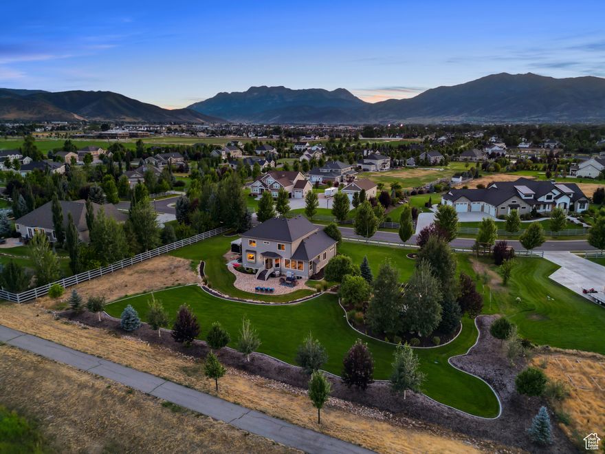 Welcome to this stunning custom residence in the highly sought-after Triple Crown Estates-a community known for its spacious lots, luxurious homes, and sweeping Wasatch Mountain views.  This beautifully crafted home offers 6 bedrooms plus an office and 5 bathrooms, including a spacious primary suite designed for relaxation and privacy. Whether you're hosting guests or accommodating a growing family, there's ample room for everyone.  Inside, you'll find a well-appointed kitchen with generous counter space and open-concept living areas that flow seamlessly-perfect for everyday living and entertaining. The newly finished basement adds valuable square footage with a large TV/game room, two bedrooms, and two additional bathrooms-ideal for guests, teens, or multi-generational living.  Step outside to enjoy a full acre of serenity, complete with gorgeous mountain views, a fire pit, and a spa-an ideal setting for peaceful evenings under the stars. Offered mostly furnished, this home is ready for you to move in and start enjoying the mountain lifestyle right away.  Adventure-ready? The upgraded, heated 3-car garage is outfitted with ample storage, a large workspace, and a high-end custom locker system to keep your gear organized for every season.  All of this is located just minutes from world-class recreation, golf, and dining-only 11 miles from Deer Valley East Village and 20 miles to Park City. Rarely does a home combine luxury, comfort, and location so effortlessly. Don't miss your chance to own in one of Heber's most premier neighborhoods!