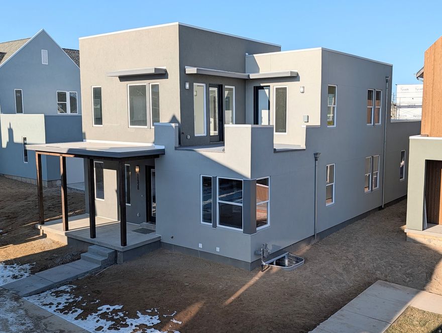 Brand New Home with Spacious 3-Car Garage! This home includes a fully finished basement and stunning designer upgrades such as quartz countertops throughout, a wet bar, gas range, upgraded cabinetry, hard surface flooring, and more. The open floor plan features a generous great room that flows seamlessly into the dining area and kitchen, complete with a large island and walk-in pantry, perfect for entertaining. The impressive primary suite boasts 12-foot ceilings, an oversized walk-in closet, a luxurious en-suite bathroom, and direct access to a hot-tub-ready balcony with breathtaking views. Estimated completion: February 2026.