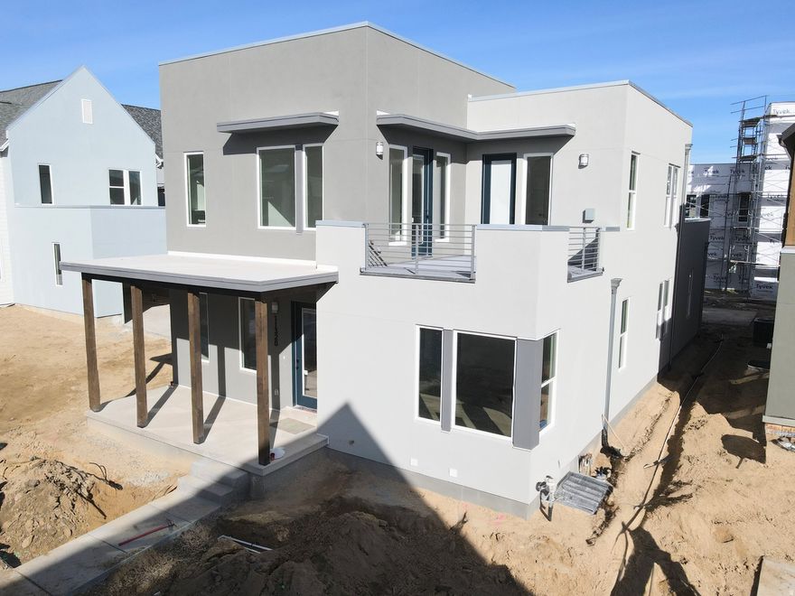 Brand New Home with Spacious 3-Car Garage! This home includes a fully finished basement and stunning designer upgrades such as quartz countertops throughout, a wet bar, gas range, upgraded cabinetry, hard surface flooring, and more. The open floor plan features a generous great room that flows seamlessly into the dining area and kitchen, complete with a large island and walk-in pantry, perfect for entertaining. The impressive primary suite boasts 12-foot ceilings, an oversized walk-in closet, a luxurious en-suite bathroom, and direct access to a hot-tub-ready balcony with breathtaking views. Estimated completion: February 2026.