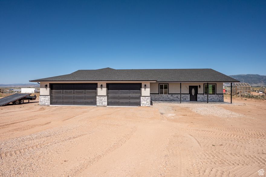 Welcome to your dream home where modern design meets rural freedom. This sprawling 3,000+ sq ft single-level masterpiece offers the perfect blend of comfort, space, and independence, all set on 1.25 acres with animal rights and no CC&Rs. Expansive open-concept floor plan with high ceilings and abundant natural light Chef's kitchen with quartz countertops, premium appliances, and a massive walk-in pantry Spacious primary suite with spa-style bathroom and walk-in closet. Designer finishes throughout-crafted for beauty and function. Breathtaking 360 views of surrounding mountains and open skies. Generous 1.25-acre lot-bring your animals, build a shop, or enjoy wide-open space. With no CC&Rs truly make this property your own. Private shared well for reliable and affordable water access.