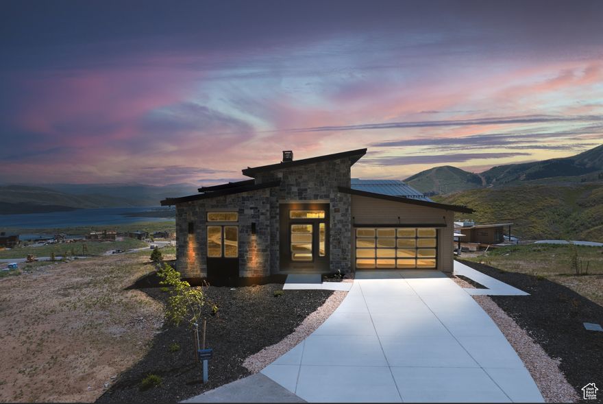 Explore Amanti Lago, an exceptional new community near Park City, offering a limited collection of just 28 homesites. Positioned above the peaceful Jordanelle Reservoir, each residence is a testament to luxury crafted for the select few. Enjoy breathtaking views of Deer Valley's ski slopes, immerse yourself in the tranquility of nature through nearby walking and biking trails, and savor year-round recreation, from skiing to boating to golfing. Ski Shuttle service to the Deer Valley East Gondola included. The Valentino Home Plan provides main floor living at its finest. Impressive entry with great room providing vaulted ceilings, soaring windows, and generous entertaining space. The primary suite offers views of the mountains and lake, spacious primary bathroom with steam shower. The main floor includes a second bedroom and home office. Bring the outdoors in with the multi slide glass door to the covered deck. Gorgeous staircase is open to the walk out basement with family room, wet bar, 2 additional beds and baths and even more outdoor space. Pictures are of the Valentino Mountain Traditional elevation. Options and selections will vary. Buyer to verify all. Ask agent about current incentive.  Estimated completion December 2025.
