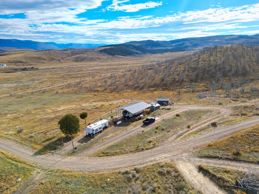 Escape to your own slice of heaven in the Oaker Hills subdivision, just 20 minutes north of Fairview and 30 minutes south of Spanish Fork. This 5.17-acre lot sits on a gentle hillside and offers breathtaking valley views in every direction.  This property is ready for you to move right in and start living your off-grid dream! This sale INCLUDES a 2013 RV travel trailer under a covered carport, plus two metal buildings-one for storage and another housing the power system. With seven large solar panels, eight batteries, and a generator included, you'll have reliable power year-round.  Enjoy the peace of mind of having your own well with great water, .75 acre-feet of water rights, a septic tank, and four water spigots already in place. Roads are maintained year-round, giving you easy access while still enjoying privacy and wide-open space with no close neighbors.  Whether you're looking for a full-time off-grid lifestyle or the perfect weekend getaway, this property has it all-views, water, power, and comfort. You won't find a better deal than this!