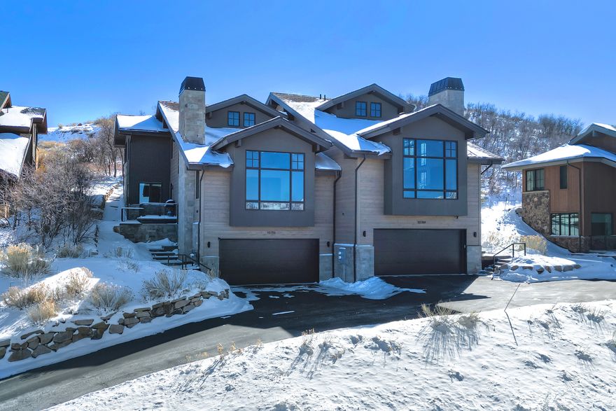 Custom Luxury Townhome - Deer Valley & Water Views  This stunning 4 bed/5 bath Hideout townhome checks all the boxes. The location offers sweeping views of the Jordanelle Reservoir, Deer Valley Resort, and Sky Ridge Peak. Arriving conveniently near the main entrance to Hideout, pull into an oversized two-car gargage with slat walls and built-in storage. Stash your jacket in the mudroom lockers across from the downstairs laundry room. Around the corner, you'll find the oversized bonus room and a large guest suite with ensuite bath.    Upstairs you'll find the main entry landing, a private patio space, and the main living area. Past the expansive main-floor primary suite, powder room and pantry, step into the open and light-drenched kitchen and great room. An effortless entertaining environment, with the kind of elevated luxury feel typically reserved for homes at twice the price point. Fisher Paykel appliances, sleek hardware, wood cased windows, and solid core doors, along with wide-plank light oak hardwoods provide an incredible canvas for all decor styles. Whether you're hosting guests or settling into a quiet evening with the reservoir glowing at golden hour, this home delivers the lifestyle you've been chasing. And, when it's time to wind down, the top floor's loft, two additional bedrooms, and back patio-with hot tub hookups-offer additional room to escape.  Just minutes from the new Deer Valley Jordanelle Gondola, summer boating or paddling on the Jordanelle, sprawling neighborhood trails, the neaby dog park, and nine-hole Outlaw golf course make Hideout one of the most desirable communities in the greater Park City area. A quick drive puts you on Park City's Historic Main Street, and seamless access to US-40 means Salt Lake City International Airport is just over thirty minutes away.  This is mountain luxury without compromise.