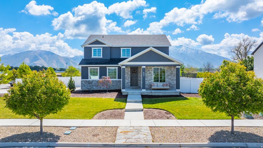 Beautifully upgraded 4-bedroom, 3-bath home in Springville offering a desirable corner lot, incredible unobstructed Mountain View's, and NO backyard neighbor. Property backs up to peaceful farmland with horses for rare privacy. Just a few minutes away from the freeway, Smiths grocery and other amenities; it offers tremendously quick access. School is just a walk away.   Over $100k in upgrades including a $50K solar system with battery backup, whole-house water filtration (RO, UV, multi-stage), and professionally landscaped $60K yard featuring a large patio, fire pit, mature trees, drought-tolerant grass, irrigation, and raised garden beds.  Note the trees in the front yard compared to everybody else's. This home has been immaculately maintained.  Floor plan make total sense, open, spacious and inviting. Interior highlights include quartz countertops throughout, custom primary closet system, whole-house fan, UV window film, and smart home features including Ecobee thermostat, smart locks, Nest smoke/CO detectors, and SimpliSafe security. Google Fiber ready and all appliances included-even washer/dryer, refrigerator, and garage freezer. Save money on the blinds, they stay too.  Move-in ready and easy to show!