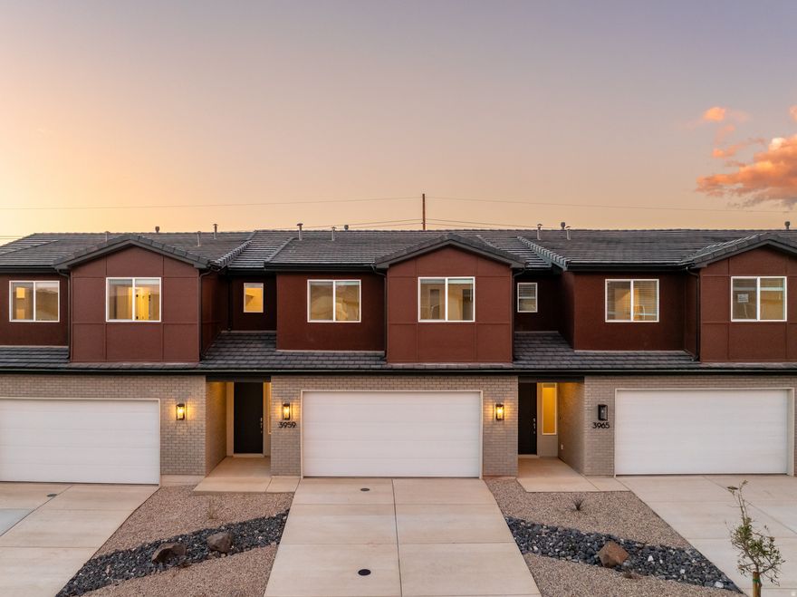 Welcome to the Sunburst, a beautifully crafted 2-story townhome featuring 3 bedrooms and 2.5 bathrooms within 1,843 square feet of refined living space. The standout feature of this home is the versatile loft, perfect for creating a second living area or enjoying family movie nights. Two of the bedrooms offer spacious walk-in closets, while the primary suite boasts a sleek Euro glass shower and dual vanity for an elevated bathroom experience. Designed to simplify everyday living, the Sunburst features a conveniently located second-floor laundry room, along with a 2-car garage and high-end finishes, offering an elevated living experience in the sought-after Coral Canyon community.