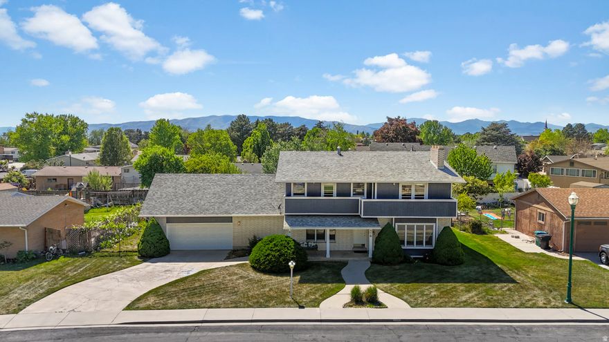 Home full of vintage charm, character and potential! Welcome to this spacious one-of-a-kind custom home in the heart of Orem - a property built with personality that's hard to find today.  You'll discover cozy nooks and crannies, built-ins, and thoughtful spaces throughout the home that reflect a different era of home design. This home has been well cared for and offers an incredible opportunity for someone with vision and creativity to make it their own. Built in 1974 and tucked into a desirable neighborhood on a flat, fully fenced .24-acre lot, this home is full of delightful surprises around every corner from the charming custom kitchen with its vintage-style stove, double ovens, and water fountain hookup, to thoughtful features like a laundry chute, heat lamps, and extended balcony with east facing mountain views. The spacious floor plan offers room to spread out, gather, and make memories for generations to come. The main level features formal and casual spaces, mud room, separate laundry room, and a den/flex space for homework, music lessons, or a library. The second level with 4 bedrooms includes a large primary suite with wood-burning fireplace, his and her closets, and double vanities. In the basement you'll find a separate entrance, 2 large gathering spaces, 2 bedrooms, bathroom, and tons of storage. 3 furnaces (2022), water softener, and central air conditioning (2022) for the main level provide important functionality and recent updates include a newer roof (2023), and water heater (2025). The 2nd level stays naturally cool thanks to refreshing canyon cross breezes, and a window A/C unit is also included. Washer, dryer, and refrigerator are all included as well. The location is hard to beat - just minutes from UVU, I-15, shopping, dining, and schools, 12 minutes to BYU, and just 20 minutes from skiing, biking, and year-round recreation at Sundance Mountain Resort. This home offers an incredible opportunity for someone with vision to thoughtfully blend vintage character with modern touches and create something truly extraordinary. Whether you love preserving classic charm or dream of adding your own personal style, the potential here is undeniable. Homes like this don't come along often - be sure to view the 3D tour and schedule a showing today!