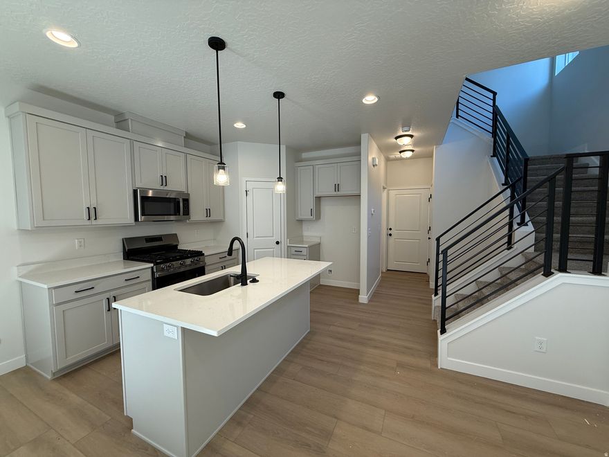 MOVE-IN-READY!!  An incredible value in a prime location.  Close to everything you could need.  This super spacious 2 Bedroom townhome is the perfect layout.  9' ceilings on the main floor, waterproof wood laminate, upgraded cabinetry, quartz tops throughout, modern railing and finishes, as well as tons of windows for added natural light.  HUGE bedrooms upstairs, each featuring en-suite bathrooms. Primary bathroom has dual sinks, and oversized shower.  Call/Text to see this home, and others from our Move-In-Ready Collection.  Ask about our amazing preferred lender incentives to help make your dream of homeownership an affordable reality.  #426 Buchanan from Woodside Homes in Meadowbrook.