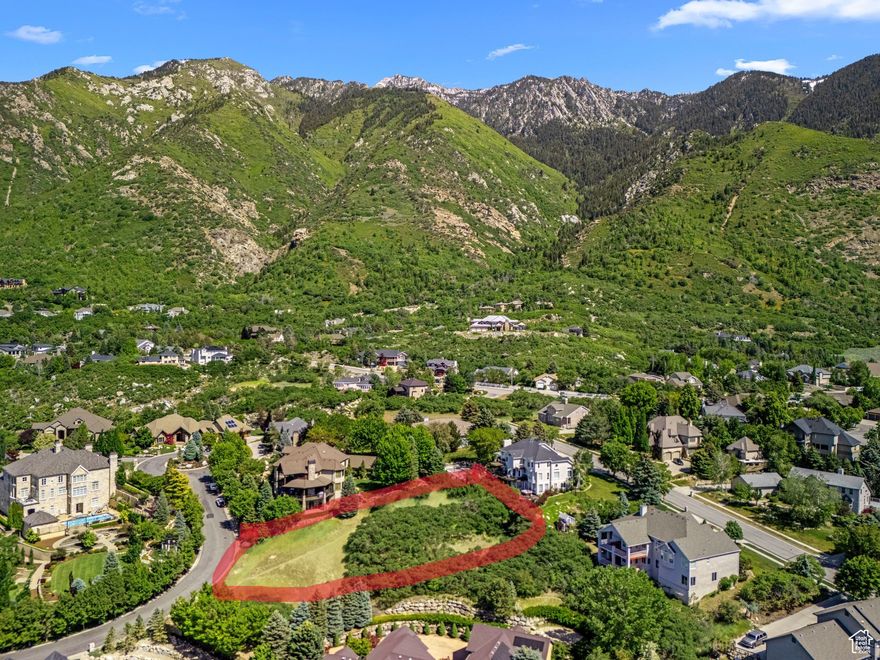 *SELLER FINANCING AVAILABLE*No Subordination*Build your legacy in one of Sandy's most exclusive Communities-Pepperwood. This expansive .66-acre custom homesite offers a rare blend of privacy, prestige, and panoramic views of the Wasatch Mountains including valley views. Set within a secure, 24-hour guard-gated neighborhood, this premium lot is nestled on a quiet, upscale street surrounded by stunning luxury residences.  The land is gently sloped, ideal for a walkout basement, and comes utility-ready with stubbed connections. Pepperwood offers unmatched amenities including a resort-style pool, lifeguards, competition swim team, large splash pad, spa, clubhouse, tennis and pickleball courts, playgrounds, park,sand volley ball and private walking/biking trails-all maintained to the highest standards.  Located just minutes from world-renowned ski resorts, hiking trails, top-rated schools, and shopping, this is an exceptional opportunity to design a one-of-a-kind estate in a community that defines elevated Utah living.The red lines is not the exact property line but close.The red line is to show you where the lot is on the aerial photos.