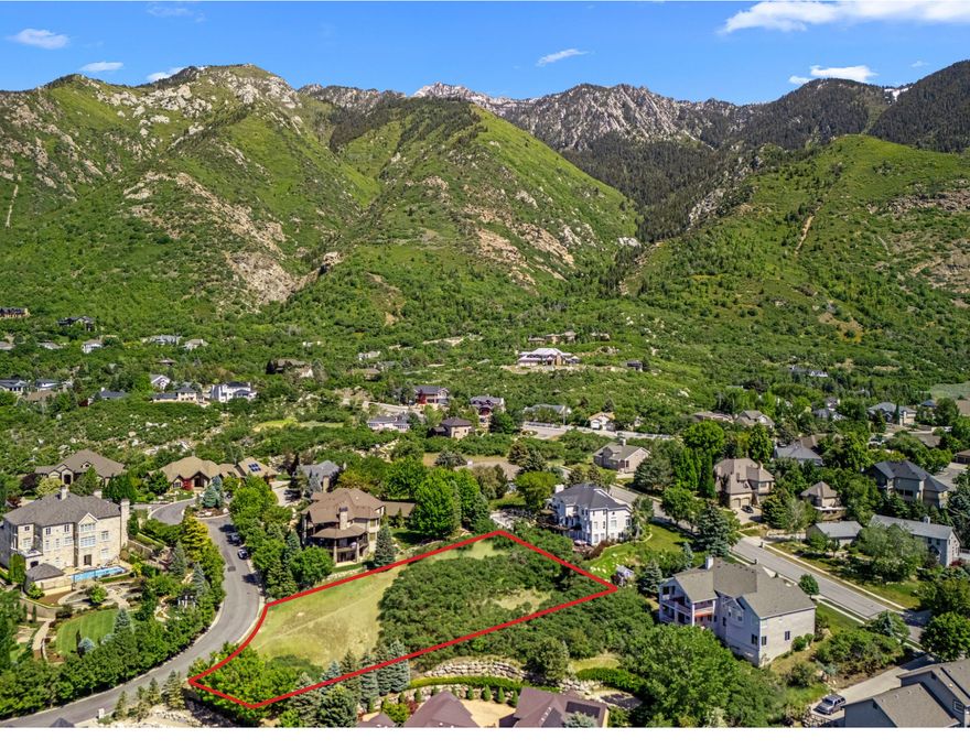 *SELLER FINANCING AVAILABLE*No Subordination*Build your legacy in one of Sandy's most exclusive Communities-Pepperwood. This expansive .66-acre custom homesite offers a rare blend of privacy, prestige, and panoramic views of the Wasatch Mountains including valley views. Set within a secure, 24-hour guard-gated neighborhood, this premium lot is nestled on a quiet, upscale street surrounded by stunning luxury residences.  The land is gently sloped, ideal for a walkout basement, and comes utility-ready with stubbed connections. Pepperwood offers unmatched amenities including a resort-style pool, lifeguards, competition swim team, large splash pad, spa, clubhouse, tennis and pickleball courts, playgrounds, park,sand volley ball and private walking/biking trails-all maintained to the highest standards.  Located just minutes from world-renowned ski resorts, hiking trails, top-rated schools, and shopping, this is an exceptional opportunity to design a one-of-a-kind estate in a community that defines elevated Utah living.The red lines is not the exact property line but close.The red line is to show you where the lot is on the aerial photos.