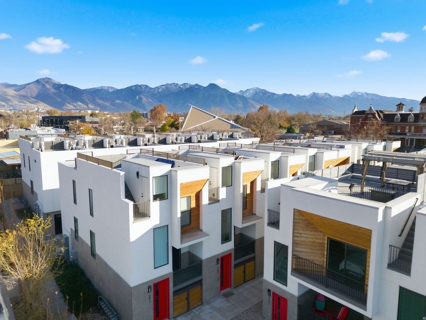 Experience urban living at its peak in this modern Sugar House townhome. Three bedrooms, each with its own ensuite, paired with a sleek kitchen and a warm living room featuring a custom wood entertainment wall. The true showstopper: a huge rooftop deck with rare 360 views of the Wasatch Front and Salt Lake Valley. This home also features a super-deep 1-car garage with room for a home gym, and extra storage. Enjoy upgraded finishes, modern convenience, and iconic views!