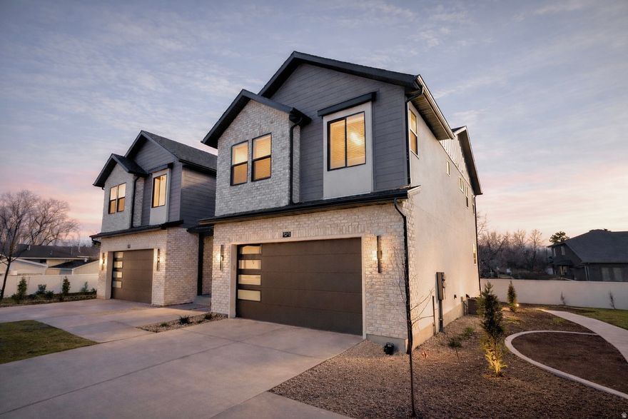 New construction in Trailside Reserve - a modern, low-maintenance community in the heart of Midvale. This stylish twin home lives like a single-family with an open great room, fireplace insert, quartz countertops, and vaulted ceilings. Estimated completion early March, with EV-ready garage, private fenced backyard, and HOA-maintained exterior and snow removal for easy living. Virtually staged; photos may vary by unit.
