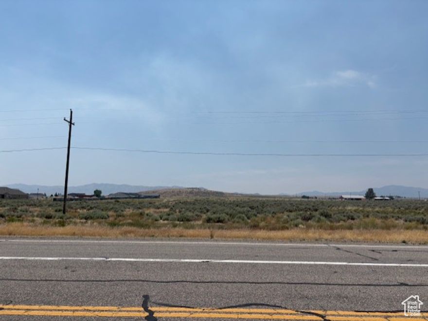 Discover the incredible potential of this 3.53-acre lot, perfectly situated directly across from the hospital and prominently fronting Highway 257. This flat parcel offers unparalleled visibility and accessibility, making it an ideal location for a variety of ventures-whether you're looking to develop a thriving business or build a welcoming housing community. With the added benefit of bordering a multi-housing development, this property has the framework for growth and success. Currently featuring partial fencing and a manageable landscape of sagebrush, it's ready for your vision.