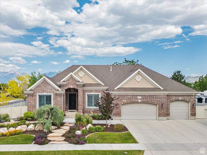 Elevated living in this former builder's model home-an elegant rambler nestled on a premium cul-de-sac lot with luxury finishes and thoughtful design throughout. As you enter, you're immediately in awe of the home's grandeur, with soaring ceilings, refined finishes, and a thoughtfully designed layout that balances beauty and function. Inside, enjoy 10' ceilings and a spacious great room that flows seamlessly into a gourmet kitchen-completely updated in 2022-featuring custom cabinets, an oversized island, granite countertops, a large pantry, a butler's pantry, and upscale finishes reflecting the craftsmanship of true custom estates.  Formal living and dining spaces offer additional comfort and flexibility for hosting or everyday enjoyment. The main-floor primary suite boasts a beautifully updated en suite with a soaking tub and separate shower. A front flex room serves perfectly as a home office or additional bedroom.  The fully finished basement features 9' ceilings, a generous family room, 4 additional bedrooms, a walk-out entrance, and is fully plumbed for a second kitchen-making it ideal for future expansion, multi-generational living, or entertaining. There's also plenty of storage space throughout, perfect for keeping things organized and out of sight.  The main-level laundry room includes a second dryer hookup for added convenience.  The 1/3-acre lot is fully landscaped with mature trees and features a front patio and an oversized deck complete with a sunken hot tub and pergola-perfect for relaxing or entertaining in style. Conveniently located near schools, parks, shopping, Bangerter Highway, and I-15.  Bonus features include a second driveway approach and two dedicated RV pads-one oversized pad capable of accommodating a rig over 40 feet, and a second side pad that easily fits a 24-foot trailer or vehicle.