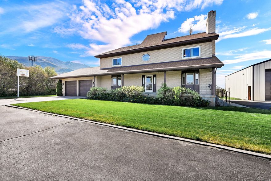 Stunning 2-story, custom designed home with energy efficiency as well as open space in mind. Beautiful cabinetry, tile floors, rock work around spiral staircase. Extras like ,laundry chute, hidden storage and garbage, built in desk, central vac, bay windows and more. Granite counter tops and designer floor tiles. Step outside to a covered patio and mountain views .Perfect for entertaining or just relax. Low energy bills w solar panels, fire place and thick cinderblock and brick wall construction.