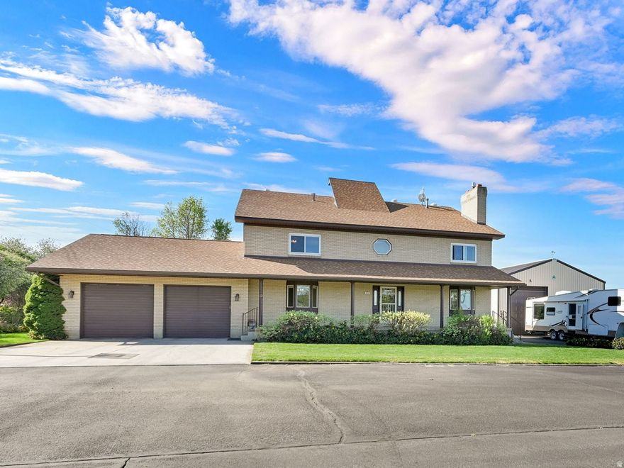 Stunning 2-story, Custom designed home, Energy efficient, Huge RV Garage Shop, Open space, Beautiful Cabinetry, Tile floors, Rock Work ,Spiral Staircase ,Laundry Chute, Cold Storage, Custom Desk office, Central Vac, Bay Windows, Mother in Law Potential Basement Apartment etc. Granite counter tops and designer floor tiles. Step outside to a covered patio and mountain views .Perfect for entertaining or just relax. Low energy bills w solar panels, Fire Place, Thick Energy Savings Walls Cinderblock/Brick Construction New Carpet Basement