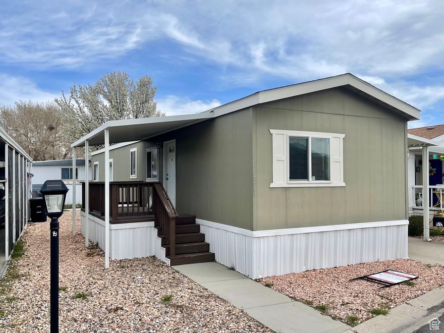 SELL WILL OFFER ONE MONTH OF SELLER-PAID LOT RENTAL.  BEST value in the entire Salt Lake County!!  Manufactured 2015!!  The LEAST expensive mobile home is all of SL County manufactured 2015 or later!!.  Age matters with Mobile homes.  Now with Fiber internet options.  Ready to move it.   Relax on your patio and enjoy your summer.   WASHER & DRYER 2-years old (included).  Great location.  Dog park just around the corner in the park.   Pool, pool tables, gym and large library/community center are at the heart of this wonderful community.  Very clean and ready to move into!!  Gas stove!!  Buyer must qualify with Majestic Meadows prior to purchasing this home (park requirement).  Seller will share a home inspection from 2022.  There is a local lender who can help with a loan for purchase.  Square footage figures are provided as a courtesy estimate only and were obtained from previous listing (1825710) .  Buyer is advised to obtain an independent measurement.