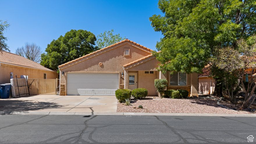 Well-maintained 3BR/2BA home in quiet, established neighborhood. Updated kitchen with new cabinets, countertops, and appliances. Converted garage provides additional living/dining area perfect for gatherings. Beautiful, mature landscaping surrounds the fully-enclosed backyard offering privacy and space to relax on the large covered patio. Side yard accommodates RV parking. Conveniently located 15 minutes from Sand Hollow Reservoir and 35 minutes from Zion National Park. This home combines the tranquility of small-town living with easy access to Southern Utah's outdoor recreation. Move-in ready with some nice, modern updates. *Square footage is an estimate. Currently verifying with the County.