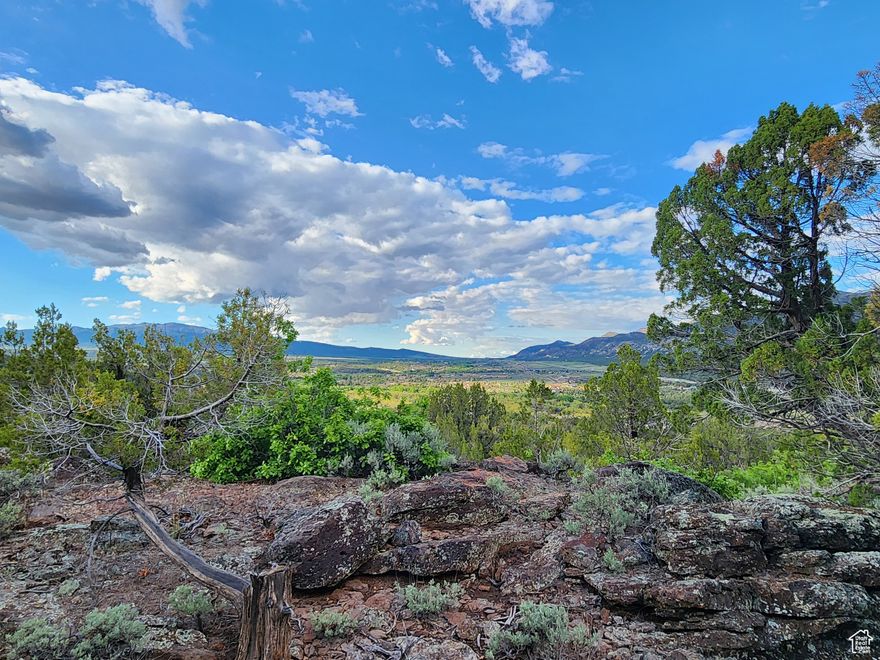 Imagine a sprawling 5-acre lot in New Harmony, boasting a panoramic view of the surrounding landscape; Zion National Park to the east, Pine Valley Mountains to the west, 360-degree views. This property is conveniently located just minutes to St. George or Cedar City. All utilities stubbed to lot and property has 1 acre share of water in the Mountain Springs water company. Ride from your home onto miles of trails ATV, hike or ride horses. This is an incredible community.