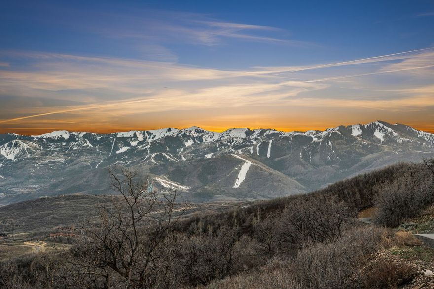 Set within the private gates of Stagecoach Estates, this exceptional 10.3 acre homesite offers a rare opportunity to own a piece of Park City's natural beauty while remaining connected to everything that makes the area so desirable. With year-round access and gently sloping terrain, the property provides multiple ideal building sites, allowing you to design a home that captures both privacy and panoramic surroundings. Included in the purchase price are full building plans, offering a seamless path from vision to reality. Surrounded by rolling hills, mature aspen groves, and abundant wildlife. This property delivers the serenity and space that define mountain living.  Expansive views stretch across the valley to Park City's world-renowned ski resorts, creating a stunning backdrop in every season-, from snow-covered peaks in winter to vibrant alpine colors in the warmer months. Located within the highly sought after Park City School District, this property offers the perfect balance of privacy, accessibility, and long-term value. Whether you're envisioning a full-time residence or a legacy mountain retreat, this offering combines acreage, views, and convenience in a premier gated community, an increasingly rare find in the Park City area.