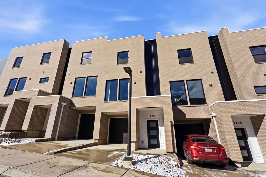 Last few new construction units remaining. Step into this thoughtfully designed 3-bedroom, 3.5-bath townhouse offering breathtaking views of the Salt Lake Valley and modern-day comfort throughout. Large windows invite abundant natural light into the home, enhancing the open and airy feel of each space. The kitchen connects effortlessly to the main living and dining areas, creating an ideal layout for both relaxed daily living and hosting gatherings.   The property includes a one-car garage plus an additional driveway parking spot for added convenience. The spacious primary suite serves as a private retreat, featuring its own en-suite bath and generous closet space. Two additional bedrooms, each with access to full bathrooms, offer flexibility for guests, family members, or a dedicated home office.  Located just moments from outdoor adventures, shopping centers, restaurants, and easy freeway access, this home delivers comfort, quality, and convenience in one of the valley's desirable areas. Enjoy stylish living with scenic surroundings in this exceptional Salt Lake Valley townhouse.
