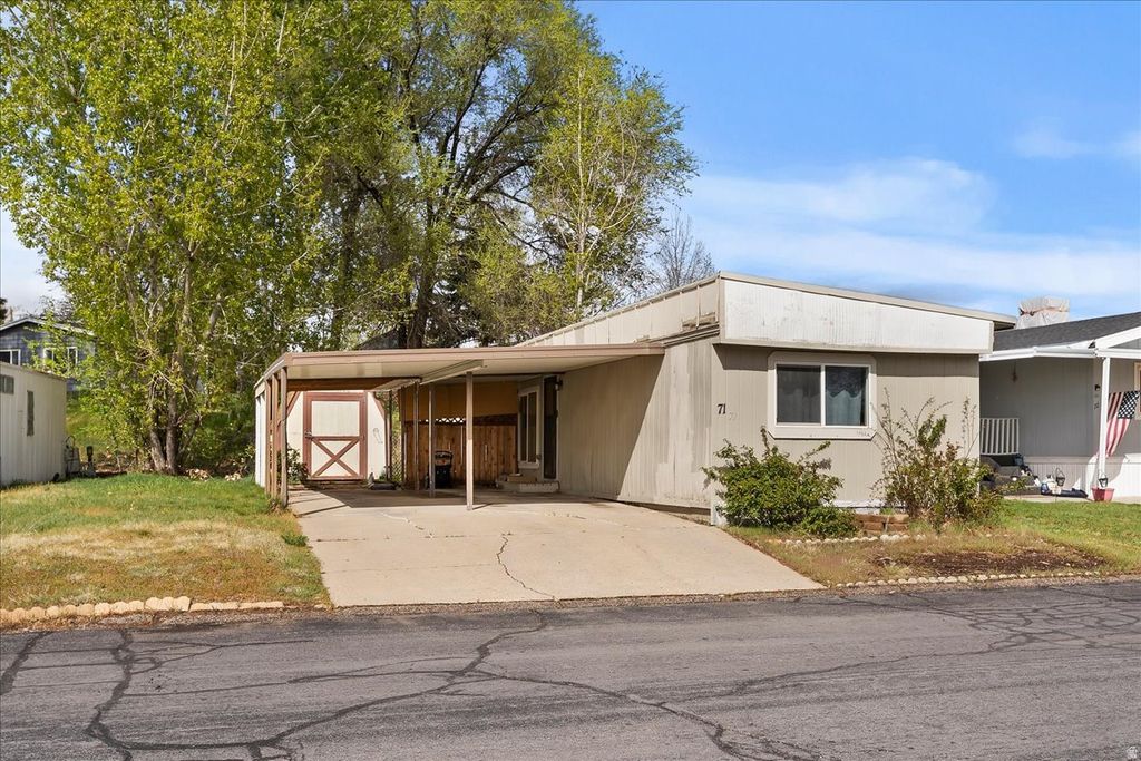 Photo of 2600 N HILL FIELD RD #71, Layton, UT 84041 (MLS # 2148719)