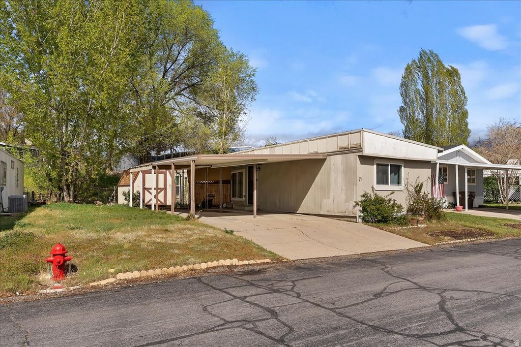 Photo of 2600 N HILL FIELD RD #71, Layton, UT 84041 (MLS # 2148719)