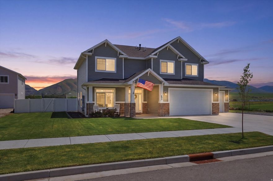 Beautiful newer home with an incredible setting and room to breathe. Enjoy a stunning upgraded kitchen featuring modern finishes, quality cabinetry, and an open layout designed for everyday living and entertaining. Situated with no neighbors to the south, this property offers added privacy, open space, and unobstructed mountain views that are hard to find. The huge yard provides endless possibilities for gatherings, play, gardening, or simply enjoying the outdoors. Located just minutes from Hyrum Dam and Blacksmith Fork Canyon, you'll have quick access to boating, fishing, hiking, camping, ATV trails, and year-round outdoor adventure right outside your door. Experience the perfect balance of peaceful living, incredible scenery, and recreation in one amazing location.