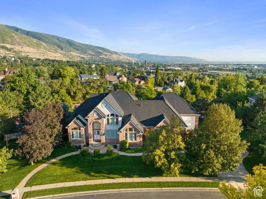 Experience luxury living at its finest in this stunning Farmington home designed for comfort, entertainment, and convenience. With spacious single-level living, this residence showcases a beautifully remodeled interior where every detail has been thoughtfully curated for modern living. The expansive main floor features a gorgeous owner's suite with spa-like finishes, oversized closets, and a relaxing steam shower option.  Sports enthusiasts will love the 25x43 indoor sports court-perfect for basketball, volleyball, or year-round play. Adventurers will appreciate the massive 41x43 RV and toy garage with extra height, 220v power, floor drain, water spigot, and dual utility sinks-ideal for boats, RVs, or hobby collections.  Recent upgrades include a new metal roof, new Trex decks, and newer appliances throughout-including furnaces, dual water heaters, and air conditioning units. The vaulted-ceiling laundry room offers abundant storage and a utility sink, while the home is fully wired with speakers, fiber internet, and even set up for a hot tub.  Step outside to your private backyard oasis, complete with a large Trex deck for gatherings or quiet evenings. Enjoy added recreation with neighborhood pool, tennis, and pickleball courts just across the street. Nestled in a quiet cul-de-sac, this home truly has it all.  Don't miss this rare opportunity-schedule your private showing today!