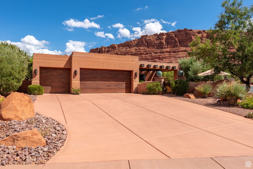 This stunning 3-bedroom, 3-bathroom home in the prestigious Kachina Springs community is perfectly positioned for shaded afternoons and evenings, allowing you to enjoy the backyard and patio year-round. A private enclosed entry with wood beam accents welcomes you inside, where stamped concrete floors, floor-to-ceiling butted glass windows, and plantation shutters set the tone for timeless elegance. The primary en-suite is composed of a gas fireplace, access to the patio, separate soaking tub and walk-in shower with his and her closets. The open kitchen features granite countertops, skylights, and high-end built-in appliances such as Sub Zero, Wolf, Fischer and Paycel. Transitioning smoothly to the living area complete with a cozy fireplace, custom plant shelves, and panoramic views of the backyard. Step outside to the backyard patio, enhanced with a built-in misting system, tranquil waterfall, and breathtaking red cliff views. Additional highlights include a 3-car garage with a mini-split system and a wet/dry central vacuum, combining comfort with convenience in one remarkable property.