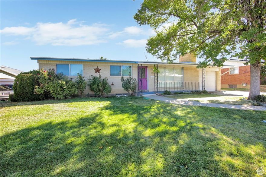 You'll fall in love with this solid brick rambler located on a lovely street on a beautiful lot.  You will want to spend every warm evening on your covered patio gazing at the flowers, fruit trees and berry bushes that adorn the fully fenced yard.  Inside you'll find an inviting living room upstairs and a spacious family room in the basement.  The home has 5 bedrooms, two 3/4 bathrooms, and a half bathroom.  You will enjoy preparing meals in the kitchen with updated cabinets and flooring.  There is storage galore with closets, storage rooms and an outdoor shed.