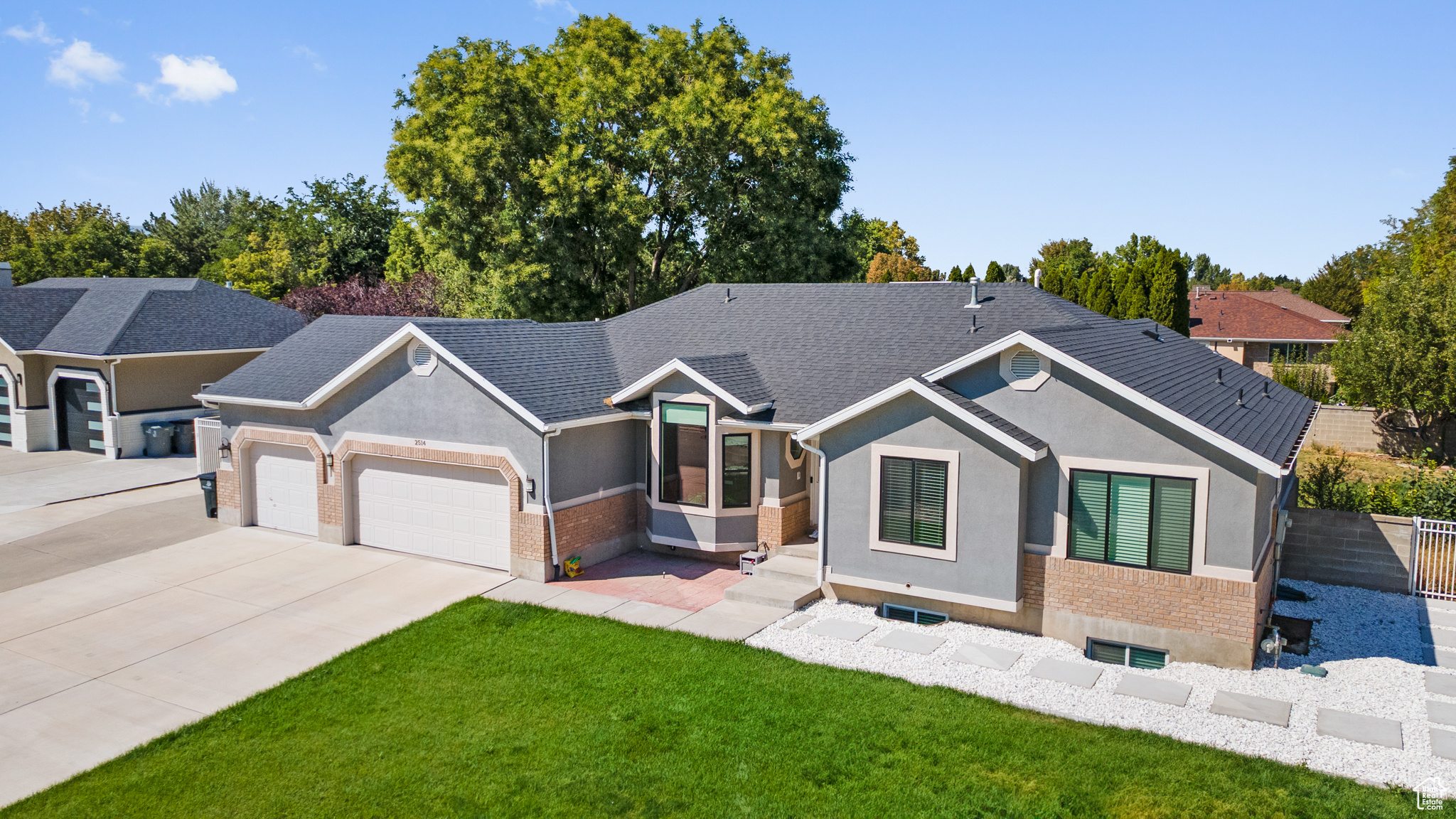 This beautifully reimagined South Jordan home delivers the perfect blend of modern updates, versatile living spaces, and an ideal location. Nestled on .33 acres in a quiet cul-de-sac just minutes from the Equestrian Park, top-rated schools, shopping, and dining, it offers the best of both comfort and convenience. The open-concept interior is filled with natural light and warm sophistication. At the heart of the home, a gourmet kitchen showcases custom cabinetry, granite countertops, premium stainless-steel appliances, and a generous island that seamlessly anchors the space-ideal for cooking, dining, and gathering. The adjoining family room with its cozy fireplace and elegant dining area creates a welcoming flow, perfect for everyday living or memorable entertaining. Featuring 6 spacious bedrooms and 3.5 bathrooms, including a primary suite with spa-like amenities and private deck access, the home offers both comfort and privacy. The fully finished walk-out basement elevates versatility with its own family room, full kitchen, three bedrooms, bathroom, laundry hookups, and private entrance-perfect for guests, multigenerational living, or an income-generating rental opportunity.