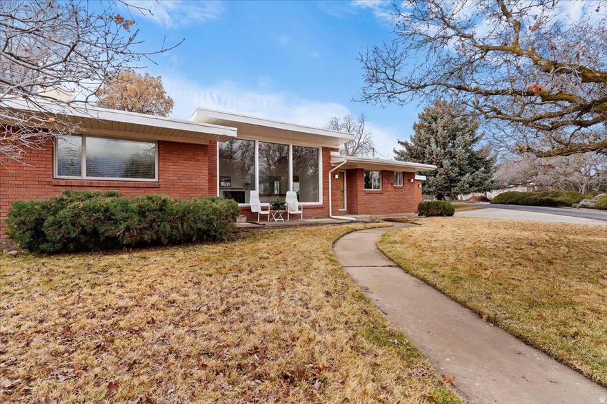 Beautifully updated mid century modern home nestled in a quiet South Ogden neighborhood. You will love the original hardwood floors with new carpet in huge family room and a brand new full bathroom. The floor to ceiling windows provide a breathtaking view of the gorgeous snow capped mountains. This one level home is move in ready with all new paint, light fixtures and updated electrical. Relax on the front patio with views or in your private, fenced backyard. Come see this beauty before it's gone. Agent is related to seller