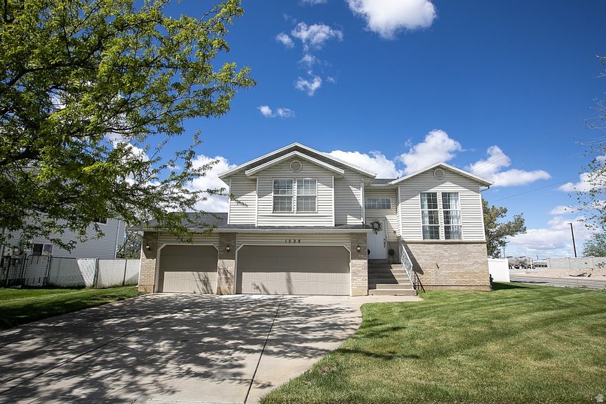 Beautifully updated Woods Cross home with so much new throughout! This spacious home features 4 bedrooms and 3 full bathrooms, offering both comfort and functionality. Major system updates provide peace of mind, including a new roof (2021), new A/C (2024), and new water heater (2023). The kitchen has been refreshed with new tile, while the basement showcases new LVP flooring. The primary suite includes a beautiful new vanity, and you'll appreciate the fresh feel from new lighting throughout. Everything that isn't new has been meticulously maintained, making this a truly special home. Enjoy the fully fenced yard, a beautiful deck, and a large patio-perfect for relaxing or entertaining. Additional highlights include updated backyard sprinklers and a fully finished 3-car garage. This well-cared-for home truly stands out-don't miss it!