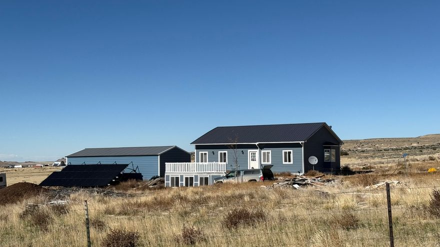 Do you dream of living off-grid, growing your own food, and escaping the trappings of the city? If off-grid living is calling for you, this house is the shortcut to your dreams, with all of the hard work of building the home done for you. This finished, entirely off-grid home, is located in the Utah West Desert. With three bedrooms and two bathrooms, it may appear to be a traditional home. Look closer and you will find redundant heating and electric systems, a greenhouse for crops, an atrium for year round indoor growing, a huge garage with workshop, fruit trees, and more. All surrounded by vast sweeping landscapes on all sides. (Bonus: this corner lot is bordered by BLM land on two sides.) Bring your horses, cows, goats, chickens, and other farm animals. With 2.1 acres, there is plenty of room for livestock. This unique, completed, off-grid home, is in a co-op that values a debt-free, and independent lifestyle. (Co-op fee is included in the price of the home.) The basement is currently unfinished, with a dirt floor, ready for you to expand the house to meet your needs. A large food storage area, and atrium are also in the basement. The co-op community is accessible by dirt roads, and requires 4WD in the winter, and is located north of the Little Sahara State Park (approximately 1 hour from Eureka). All information, figures, and documentation provided as a courtesy, buyer to verify all information.