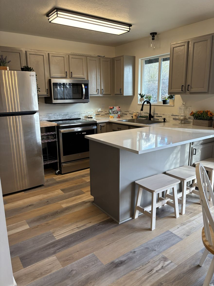 Welcome to your freshly remodeled home. Features of this renovation are Quartz Countertops, Stainless-Steel Appliances, a new finished basement featuring a theatre room, two bedrooms, a flexible space and a full bathroom. The new deck provides a place to enjoy beautiful mountain views.