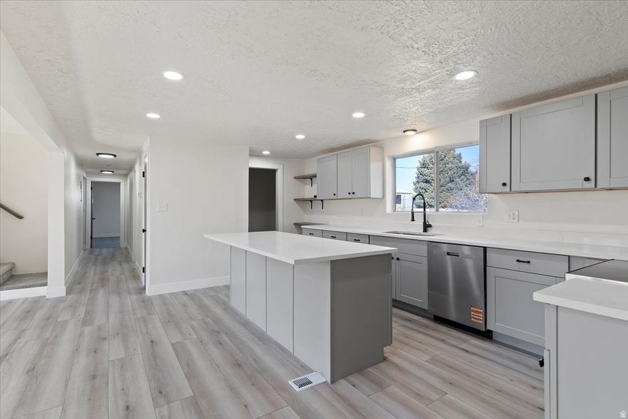 HUGE price drop for quick sale! Instant equity. Step into this **stunning, completely remodeled East Bountiful home** where modern design meets timeless comfort. Thoughtfully renovated from top to bottom, nearly everything is brand new-offering the feel of new construction in an established, highly sought-after neighborhood.  Inside, you'll find a bright, open layout filled with natural light, featuring new flooring, fresh paint, updated lighting, and high-quality finishes throughout. The gorgeous, fully updated kitchen boasts new cabinetry, sleek countertops, and modern appliances-perfect for everyday living and entertaining alike. Bathrooms have been beautifully redesigned with contemporary fixtures and clean, stylish details.  Major systems and components have been upgraded as well, giving you peace of mind and low-maintenance living for years to come. Outside, enjoy a refreshed exterior and a welcoming setting in one of East Bountiful's most desirable areas, close to parks, schools, shopping, and easy freeway access.  This is a rare opportunity to own a **move-in-ready home where nearly everything is new**, combining modern convenience with the charm and location East Bountiful is known for. Don't miss it-this one truly shines. Buyer/buyers agent to verify all info. Owner/agent.