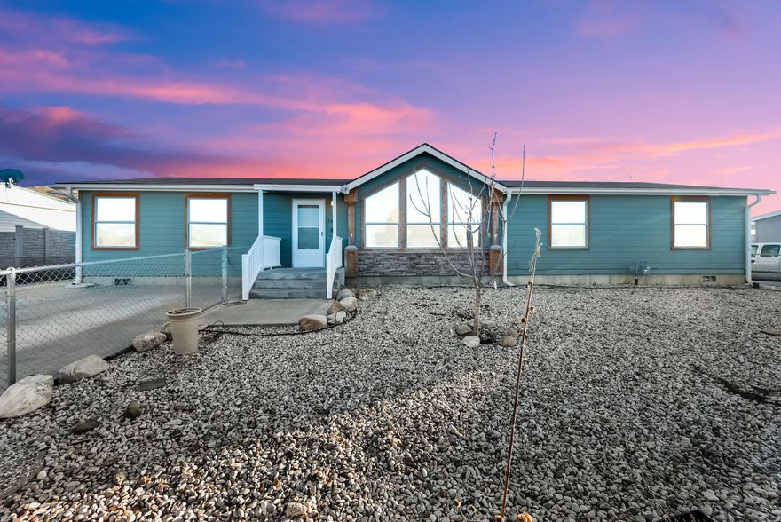 **Multiple offers received. Highest and best due by end of day today, February 9th by 6pm. If you plan to submit an offer, sellers would like to close on or before March 2.**    Well-maintained modular home on a permanent foundation, offering space, functionality, and exceptional storage. Situated on approximately one-third of an acre, this 4-bedroom, 2-bath home is ideal for those needing room for vehicles, hobbies, and outdoor living.  The standout feature is the oversized three-car garage, including a 12-foot RV bay door, radiant heating, 220-volt power, plus a mounted pulley system and air compressor for added versatility. Connected to the garage is an additional heated flex space with a gas heater, perfect for a workshop, hobby room, or man cave. Two additional sheds provide even more storage options.  The property includes owned solar panels, LeafGuard rain gutters with warranty, and a thoughtfully designed yard featuring numerous raised garden beds, perfect for gardening enthusiasts.  A rare opportunity to own a versatile property with ample garage space, energy-efficient features, and room to grow.