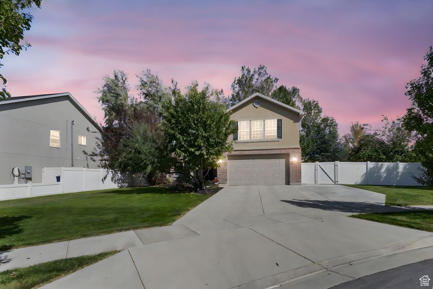 Nestled at the end of a quiet cul-de-sac, this charming and move-in ready home offers comfort, style, and thoughtful updates throughout.  Step into a bright, open layout featuring an updated kitchen with ample cabinet space, generous countertops, and a flow that's perfect for cooking, gathering, or relaxing at home. The spacious living areas are paired with oversized bedrooms and large closets - giving you room to live, grow, and stay organized. Upstairs, enjoy a versatile bonus space - ideal for a playroom, home office, or cozy hangout - plus the convenience of an upstairs laundry room. The owner's suite includes a private en suite bath and a walk-in closet, creating the perfect space to unwind.  Outside, the fully fenced backyard is ready for everything from summer barbecues to quiet evenings by the firepit. With plenty of room to play, garden, or entertain, this yard is made for memory-making. An extra-wide driveway provides abundant parking for guests, toys, or trailers. Enjoy peace of mind with newer systems, including the furnace, A/C, water heater, and water softener - offering comfort and reliability for years to come.  Located within walking distance of Butterfield Canyon Elementary and Butterfield Park, and just minutes from the Herriman Fairgrounds, Black Ridge Reservoir for paddle boarding, the new Bees Stadium, and the Utah Warriors Rugby Stadium - this home offers not just comfort and convenience, but a vibrant lifestyle filled with recreation, community, and endless possibilities. Discover the perfect balance of peaceful living and exciting nearby amenities - all waiting for you to make this house your home.