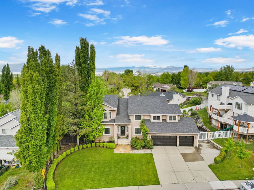 **See tour for full motion video of the home** This stunning home offers the perfect blend of luxury, functionality, and versatility. Enjoy incredible mountain views from multiple vantage points, including a serene pond and two spacious decks, ideal for both entertaining and relaxing. You'll also have a clear view of the Lindon Temple, adding to the home's gorgeous setting.  Inside, you'll find elegant formal living and dining rooms, a bright great room, and a gourmet kitchen equipped with a high-end Viking range, perfect for the inspired home chef. The primary suite is a true retreat, featuring a soaking tub, large walk-in closet, and a cozy sitting room. With two office spaces, three laundry rooms, and a fully finished ADU in the basement (with rental potential of approx. $1,300/month), this home accommodates both comfort and opportunity. Whether you're looking for a private sanctuary or additional income, this exceptional property delivers it all.    Square footage figures are provided as a courtesy estimate only and were obtained from county records. Buyer is advised to obtain an independent measurement.