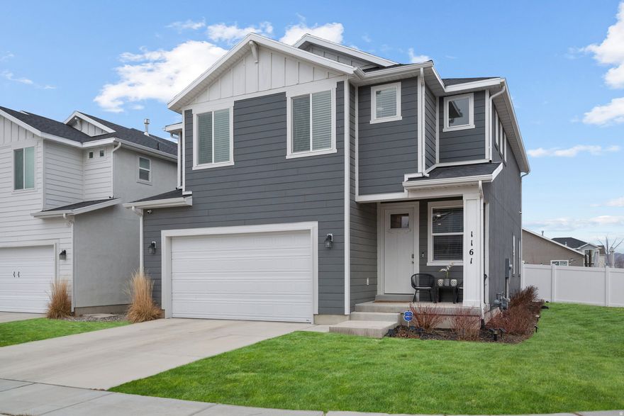 Welcome to this stunning 4 bedroom, 3 bathroom home in the sought after Harmony subdivision in Eagle Mountain. Built in 2022, this beautifully maintained 2 story offers over 3,200 square feet with room to grow and an unfinished full basement ready for your future plans. The main floor features an open and functional layout perfect for everyday living, while upstairs you'll find four spacious bedrooms including a generous primary suite with a walk in closet and separate tub and shower. The home includes central air, gas heat, full landscaping, mature trees, automatic sprinklers, and is fully fenced on a flat corner lot with beautiful mountain views. The true showstopper is the backyard, where the sellers have put incredible thought, time, and investment into creating an outdoor space that truly feels like an extension of the home. Designed for gathering and hosting, it's the kind of space that makes you want to fire up the grill and invite everyone over, whether for summer BBQs, birthday parties, game nights under the lights, or quiet evenings taking in the view. This home blends comfort, function, and lifestyle in one incredible package. Come see why this one stands out.