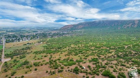 Expansive undeveloped land featuring varied terrain and natural vegetation, offering a broad natural setting with…