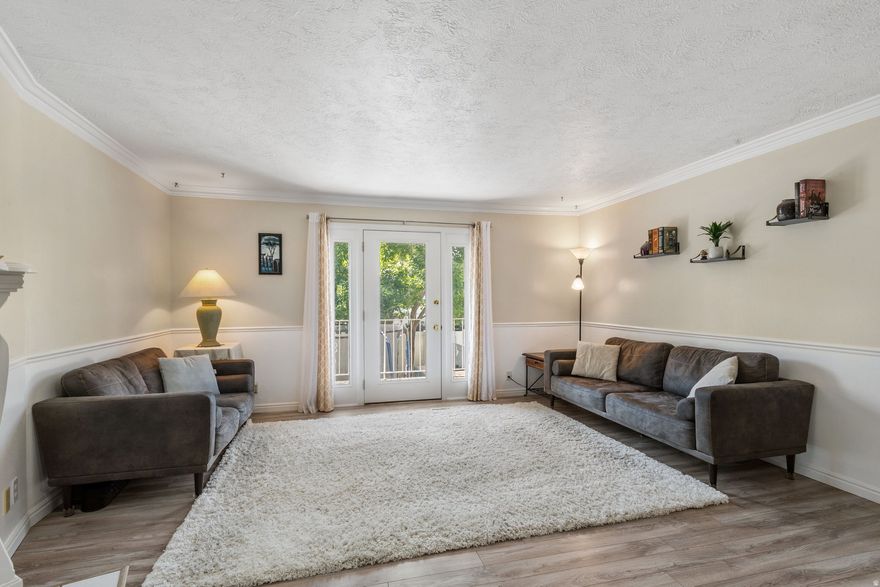 Experience the perfect blend of space and lifestyle in this spacious 1,888 sq. ft. Meadowbrook Estates townhome, ideally situated in a prime Bountiful location just steps from the elementary school and directly across from the South Davis Rec Center. The light-filled main level features a seamless open-concept great room anchored by a decorative fireplace, with elegant French doors opening to a private balcony that overlooks a large, fenced backyard. Modern LVP flooring flows through the upper level, while the cozy lower level provides a secondary living area and a versatile den perfect for a home office. With two bedrooms and a full bath on each floor, the layout offers exceptional privacy and flexibility, including a walkout basement for effortless outdoor access. Modern upgrades provide peace of mind, including a 2022 water heater, 2025 water softener, 2026 swamp cooler and a newer dishwasher, while the detached garage and two additional parking spots-one right at your front door-ensure plenty of convenience. The all-inclusive HOA covers water, sewer, trash, gas and common area maintenance. This an incredible opportunity for low-maintenance living with easy I-15 access.