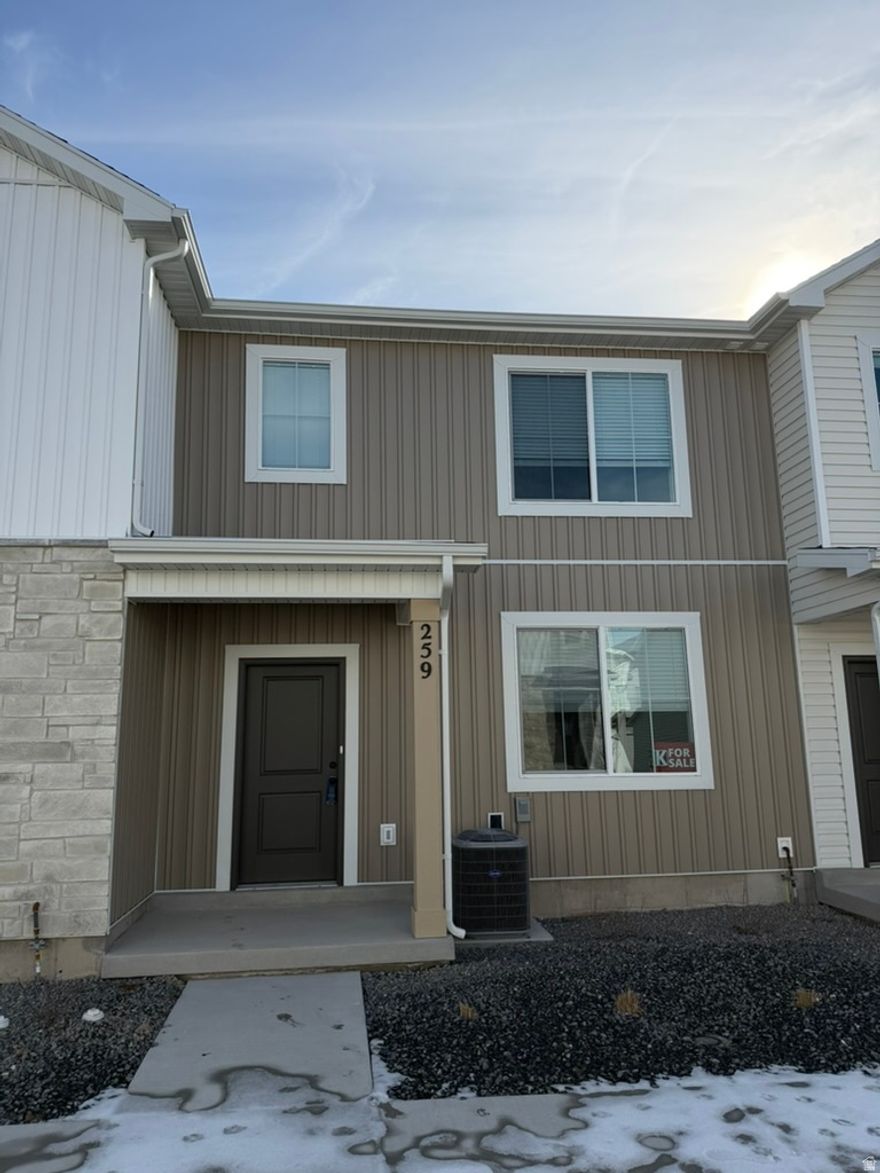 Seller offering a $10,000 incentive PLUS a fridge, washer, and dryer for a limited time! Also take advantage of the $20,000 first time home buyer grant from the state of Utah!  Come check out this beautiful NEW townhome in an amazing community! Has a big grassy area just outside the front door.  This home has a 2 car garage, a large open kitchen and living space with high quality finishes including quartz countertops, LVP flooring, and stainless steel appliances. Upstairs you'll find 3 bedrooms, including a large primary suite with its own walk in closet. Enjoy all the amazing community amenities like the premium clubhouse, pool, spa, dog park, pavilion, basketball court, pickleball court, & playground. Enjoy beautiful views from this incredible location as well. HOA covers all exterior landscaping maintenance, exterior building maintenance, snow removal on driveways, property & liability insurance coverage, trash and internet up to 1 gig of high speed fiber optic. Two year builder warranty included. Pictures are of a previously built unit.  Scheduled to be move in ready in June, but have another one just like it that is move in ready.  Square footage figures are provided as a courtesy estimate only and were obtained from sales brochure. Buyer is advised to obtain an independent measurement.
