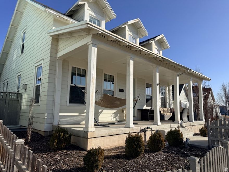 Welcome to the good life. Imagine waking up early, grabbing your board, and being just steps away from the water for a peaceful sunrise paddle on Oquirrh Lake. This isn't just a house; it's a launchpad for a life well-lived. This light, bright, classic Cape Cod home, with over 4,000 square feet, is all about effortless style and smart design. The moment you walk through the door, the open-concept layout just feels right-perfect for keeping everyone connected, whether you're hosting a big holiday gathering or just hanging out after school. The grand kitchen is the heart of it all, with an oversized island, white cabinets, light neutral quartz countertops- it will quickly become your favorite space. For those who value both togetherness and personal space, this home has you covered. With 5 spacious bedrooms, 3.5 bathrooms, and family rooms on every floor, there's space for everyone. The main floor primary bedroom suite is your personal retreat, with a walk-in closet, an extra-long vanity, double sinks, soaker tub, and a separate tiled shower. The oversized main floor laundry suite, deep walk-in storage rooms, and spacious garage keep life organized and uncluttered. This home is built for making memories, from watching vibrant sunsets over the water to celebrating milestones with loved ones. This is the good life, and it's waiting for you here.  Square footage figures are provided as a courtesy estimate only and were obtained from county records. Information is deemed reliable but not guaranteed. Buyer and buyer's agent to verify all.