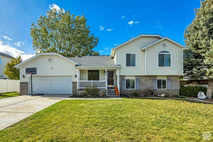 NEW PRICE! Beautifully Updated 4-Bedroom, 3-Bath Home. This stunning home features a spacious open-concept layout with both a formal living room and a comfortable family room, perfect for entertaining or relaxing. The upgraded kitchen showcases granite countertops, modern cabinetry, and a premium oven range hood, offering both style and functionality. The lower basement is unfinished, providing excellent potential for future customization. Recent updates include a newer roof (2022), and Low-E triple-pane vinyl windows for enhanced energy efficiency. The exterior features professional yard curbing, a full sprinkling system, and a mature landscape with established trees. Ideally located near two community parks, this home combines comfort, quality, and convenience. Square footage figures are provided as a courtesy estimate only. Buyer is advised to obtain an independent measurement.