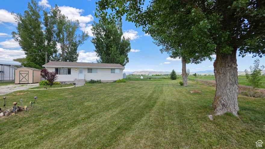 Quiet country living at it's finest. Enjoy this 1/2 acre lot surrounded by farm land.  This rambler style house has enough space for the whole family. This 5 bedroom 2 bath home has been well maintained.  Shed provides extra storage/workshop space.  Contact agent today for your private showing!  Square footage per previous appraisal; buyer/agent to verify all.