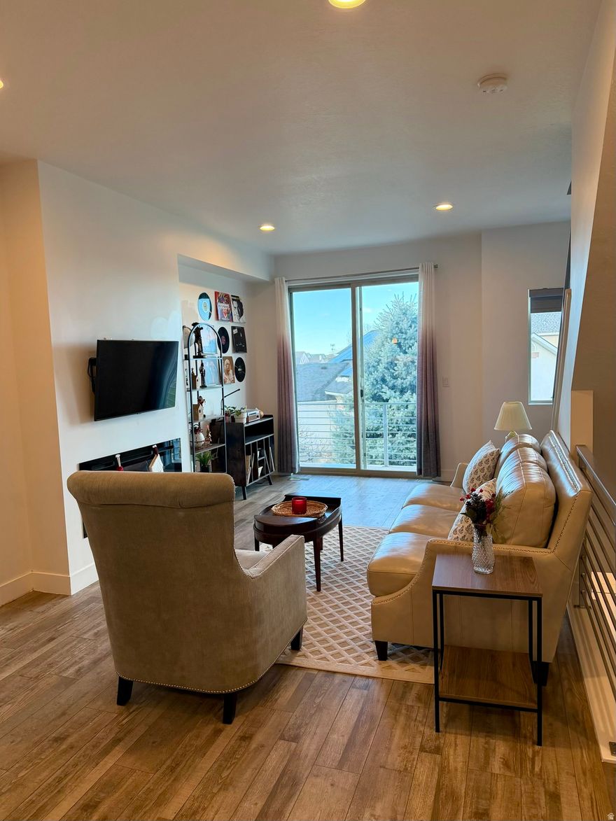 ***SELLER IS OFFERING $5,000 TOWARDS BUYERS CLOSING COSTS!*** Don't miss this beautifully updated townhome in an amazing Layton location! This rare Dual Master Suite layout offers incredible flexibility perfect for privacy or guests. The open kitchen features a gas range, ceiling-height cabinets, and flows into a cozy living area with a modern fireplace. A main-level bedroom/office with a full bath adds even more versatility. Upstairs, both master suites offer their own private bathrooms, including a walk-in shower and a separate tub/shower combo with European glass. Enjoy LVP flooring, sleek railings, and multiple balconies for relaxing outdoors. The community includes pickleball courts, a playground, garden space, a picnic pavilion, and planned walking/biking trails (per Layton City). All just minutes from Hill AFB, shopping, parks, schools, and I-15. Buyer is advised to obtain an independent measurement."