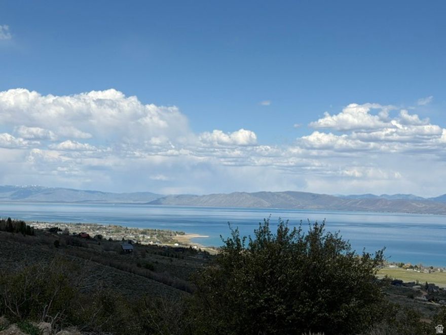 Beautiful 1.35-acre lot in the Sweetwater subdivision overlooking stunning Bear Lake. This mostly flat parcel offers the perfect canvas for your dream cabin or full-time residence, with easy access for building. Enjoy breathtaking panoramic lake views and surrounding mountain scenery, all while being close to year-round recreation including boating, ATV trails, hiking, and snowmobiling. Sweetwater optional amenities add even more appeal, which includes beach access, playground, pools and hot tubs. Don't miss this opportunity to own a prime piece of Bear Lake Paradise!